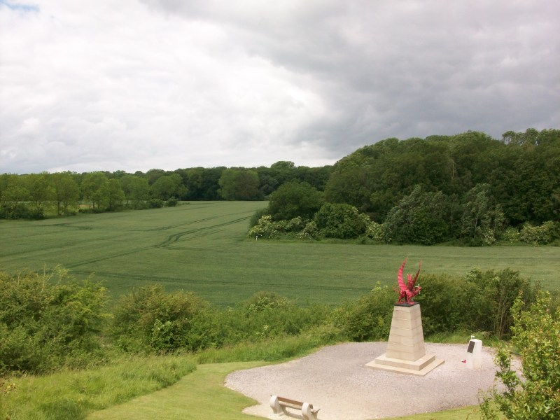 The red dragon memorial of the 38th (Welsh) Division looks out across to Mametz Wood.