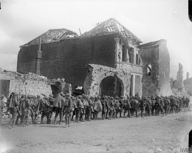 Troops of the 10th (Service) Battalion, Royal Fusiliers halted in Arras before going into action, 9 April 1917. Imperial War Museum image Q5112