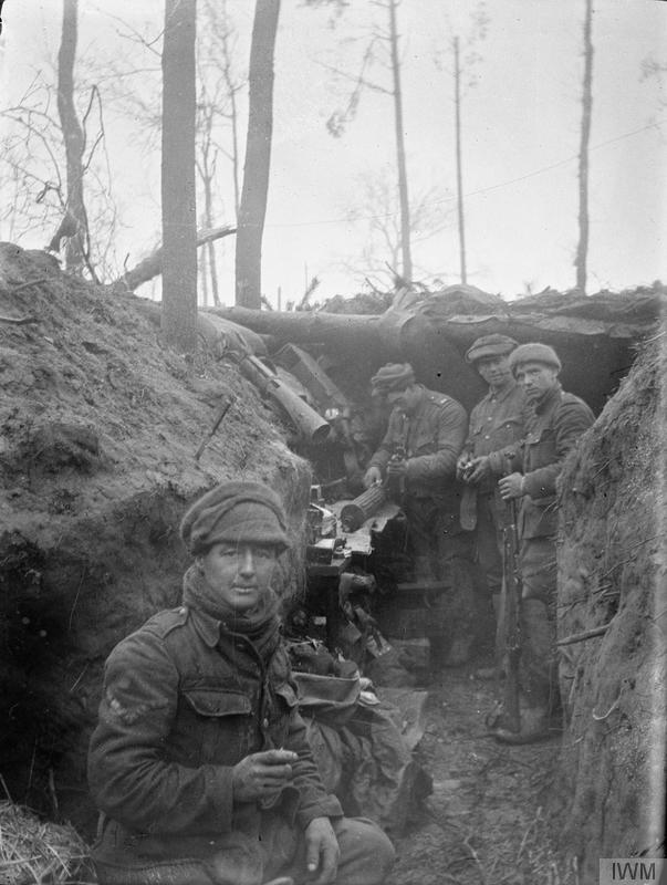 Soldiers of the machine gun section of the 11th Regiment Hussars (Prince Albert's Own) in the trenches at Zillebeke during the winter of 1914-1915. Imperial War Museum image Q51194.