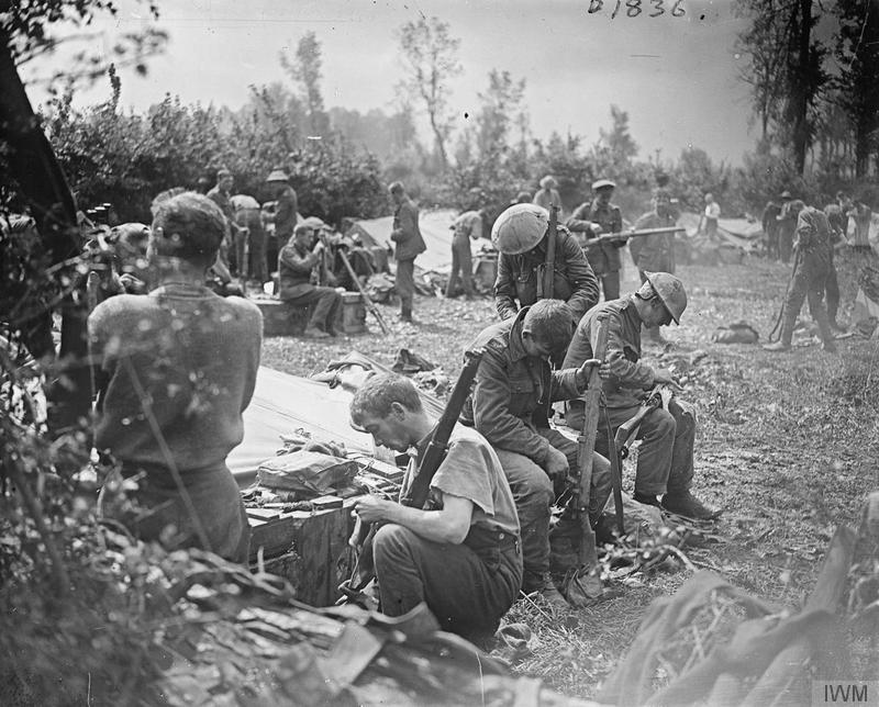 Men of the Yorkshire Regiment (Green Howards) cleaning their rifles after coming out of the line, 3 August 1917. Imperial War Museum image Q5771