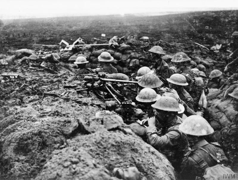 A signals section of the 13th (Service) Battalion, Durham Light Infantry, equipped with telescopes, field telephone and signalling lamps, watch the battalion's advance on Veldhoek on 20 September 1917. Battle of the Menin Road. Imperial War Museum image Q5971