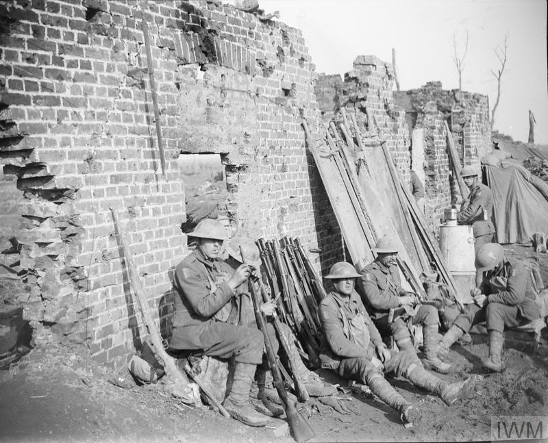 Troops of the Dorsetshire Regiment resting and cleaning rifles in the ruins of a farm near Langemarck, 17 October 1917. Troops of the Dorsetshire Regiment resting and cleaning rifles in the ruins of a farm near Langemarcke, 17 October 1917. Copyright: © IWM. Original Source: http://www.iwm.org.uk/collections/item/object/205238113