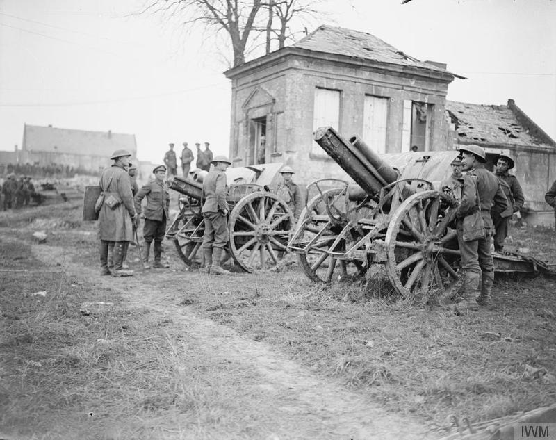 British soldiers examine two German field guns captured by the 11th (Servic) Battalion, Essex Regiment, at Ribecourt, 22 November 1917. Imperial War Museum image Q6313