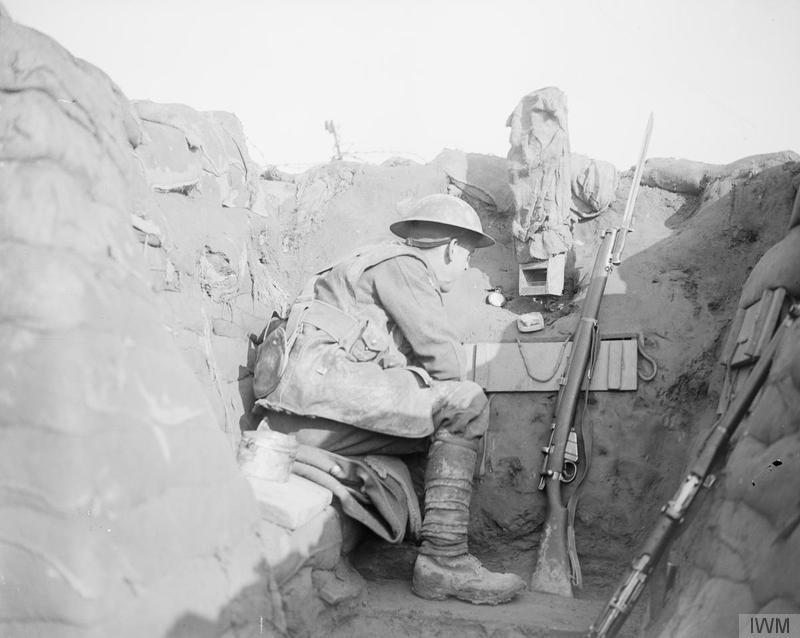 Sentry of the 1/4th Battalion, East Lancashire Regiment in a sap-head at Givenchy, 28 January 1918. Note a camouflaged periscope. Imperial War Museum image Q6472