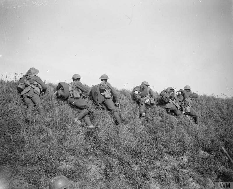Men of the 4th Battalion, Leicestershire Regiment (46th Division) firing at German snipers and machine gunners on the edge of the Bois de Riquerval near Bohain, 10 October 1918. Imperial War Museum image Q7104