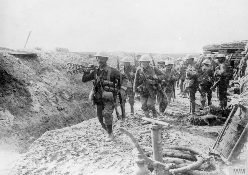 Wiring party of the 1st Battalion, Lancashire Fusiliers going up to the trenches. Beaumont Hamel, July 1916. Note a trench pump in the foreground. Imperial War Museum image Q731