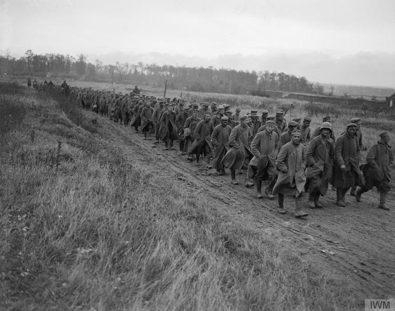 Battle of Cambrai, 1918. Prisoners taken by 63rd (Royal Naval) Division being marched in near Noyelles, 8 October 1918. Imperial War Museum image Q9513