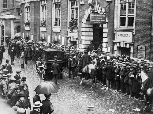 Recruits at the Whitehall Recruiting Office, London. Britain's declaration of war on Germany on 4 August 1914 was greeted for the most part with popular enthusiasm, and resulted in a rush of men to enlist. Image Q 42033, part of the Daily Mirror Collection held by the Imperial War Museum, with my thanks.